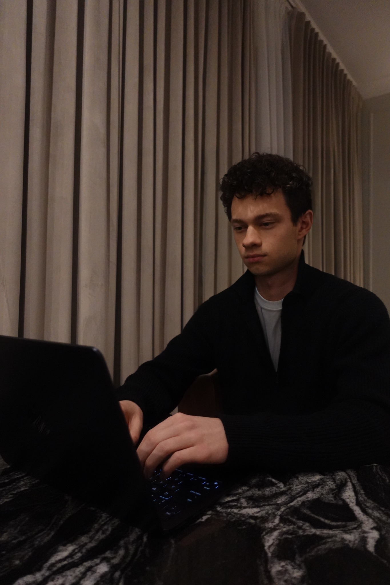 Mark Buikevich working on a laptop